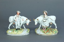 Appraisal: A Staffordshire figure of a milkmaid and cow together with