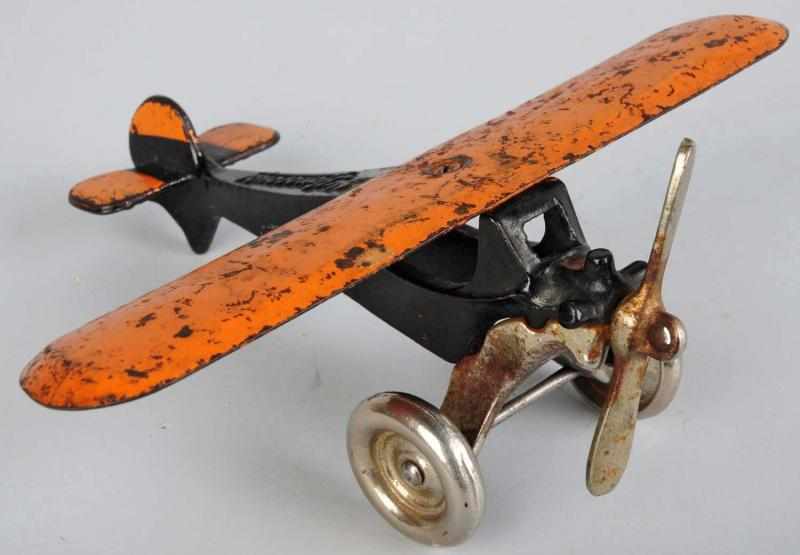 Appraisal: Cast Iron Arcade Monocoupe Airplane Toy American Nice two-tone black