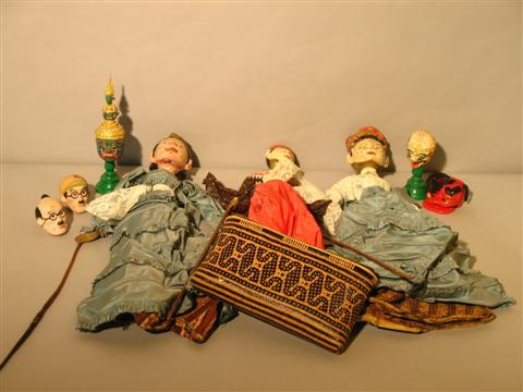 Appraisal: TWO THAI WOOD AND FABRIC PUPPETS Together with a pair