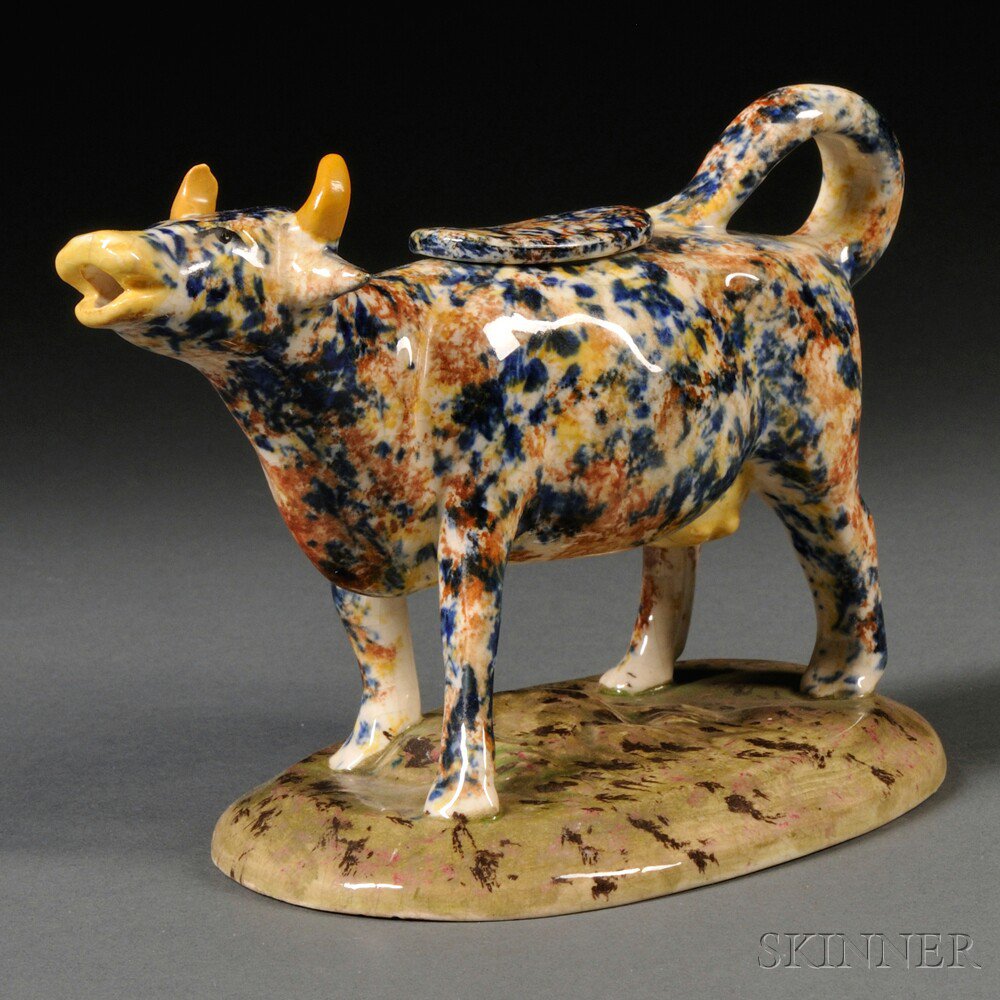 Appraisal: Staffordshire Earthenware Cow Creamer England th century spatter decorated in