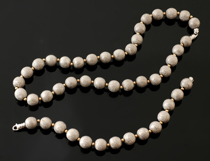 Appraisal: A white gold bead necklace and bracelet The necklace comprising