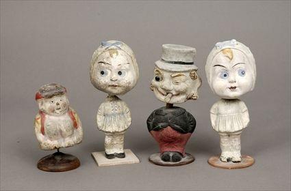 Appraisal: Four Papier-M ch Bobbing-Head Figures to in