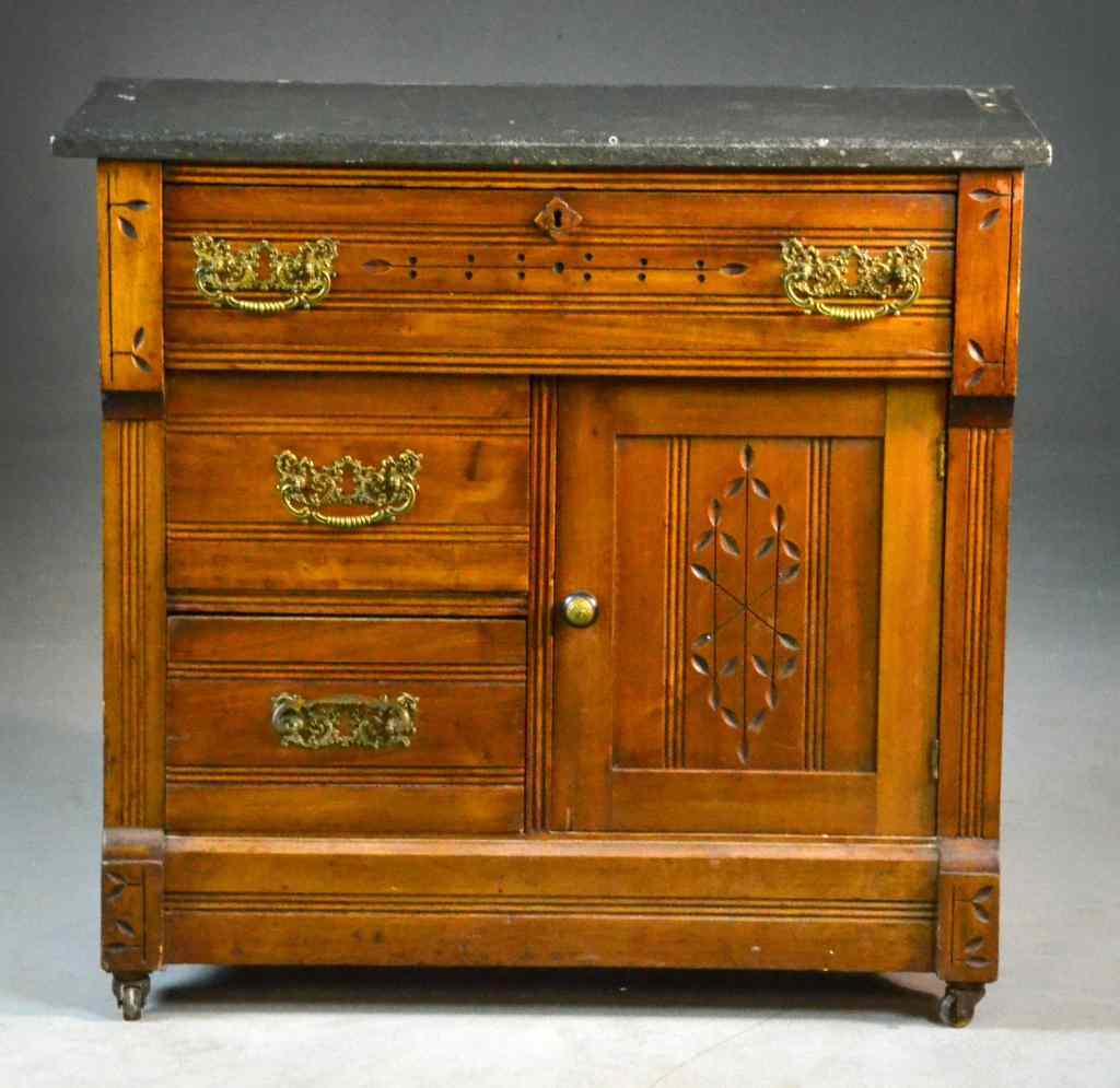 Appraisal: Eastlake Commode with Black Marble TopMarble top above one drawer