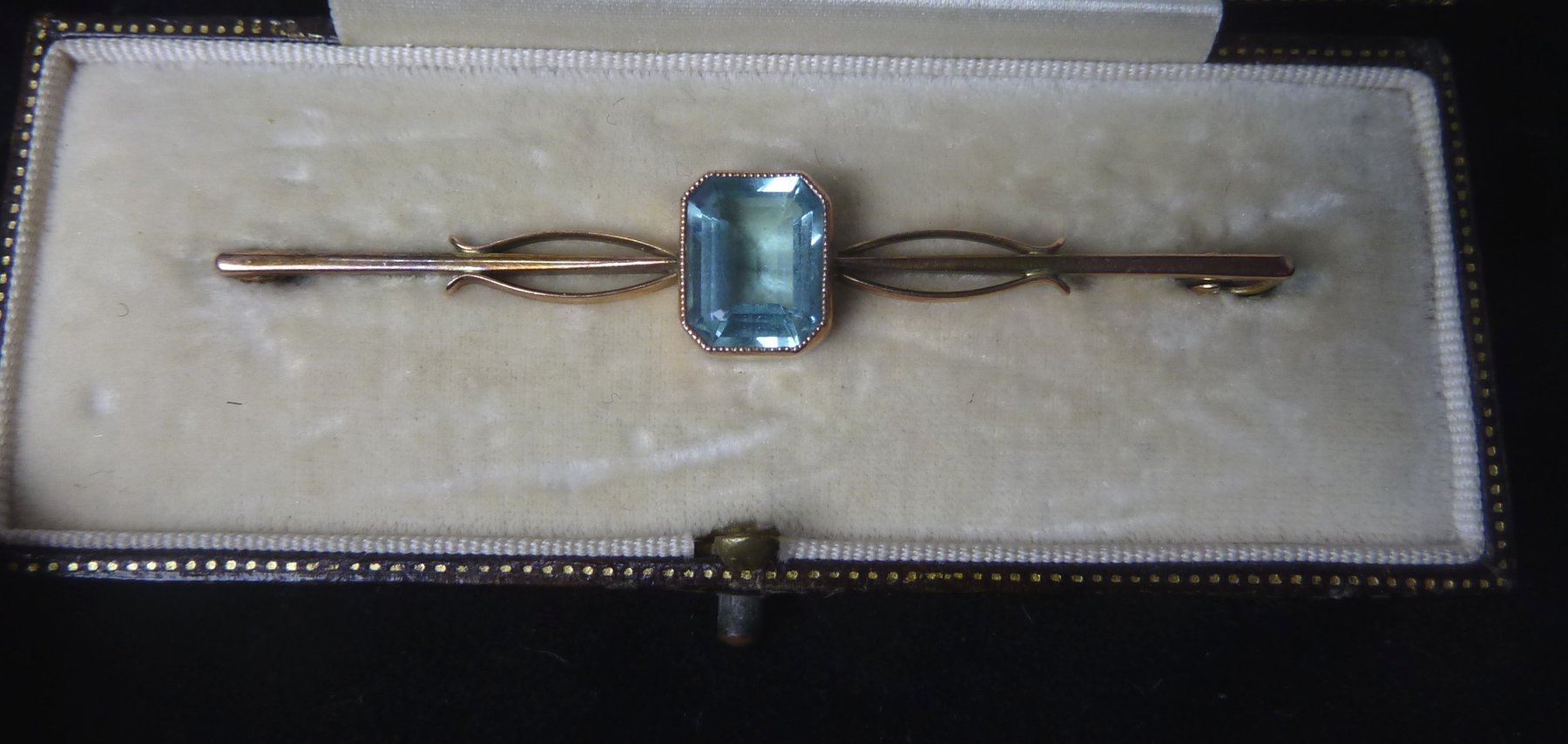 Appraisal: An aquamarine bar brooch the emerald cut stone in a