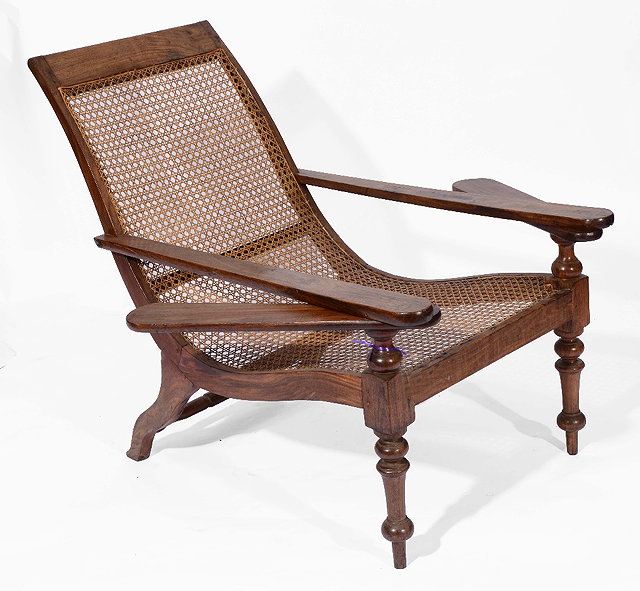 Appraisal: A SOUTHERN INDIAN PLANTERS CHAIR with cane seat and back