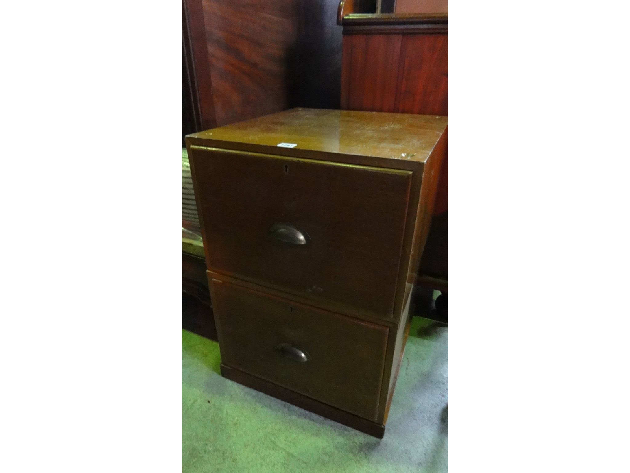 Appraisal: A vintage teak two sectional low two drawer pedestal filing