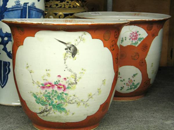 Appraisal: A pair of enameled porcelain planters Each decorated with reserves