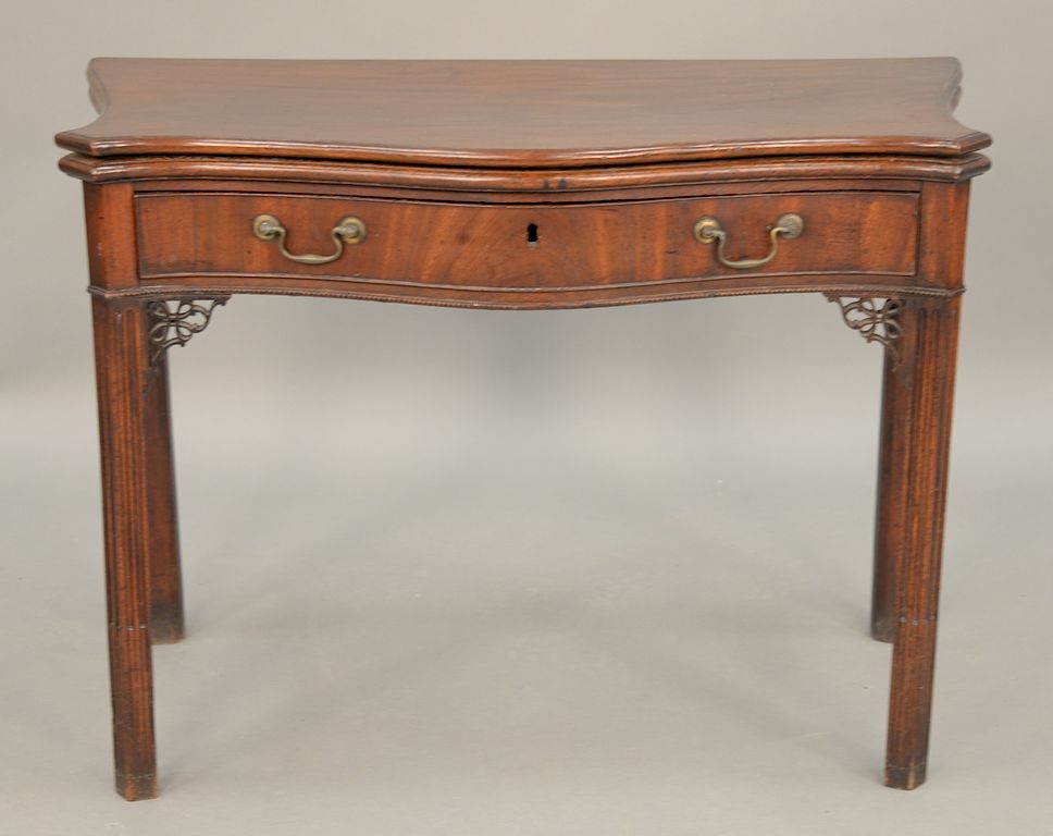 Appraisal: George II game table having serpentine top over conforming drawer