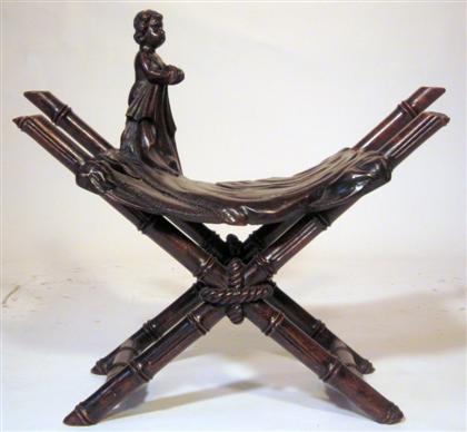 Appraisal: French art nouveau carved oak X-frame stoolCarved to simu late