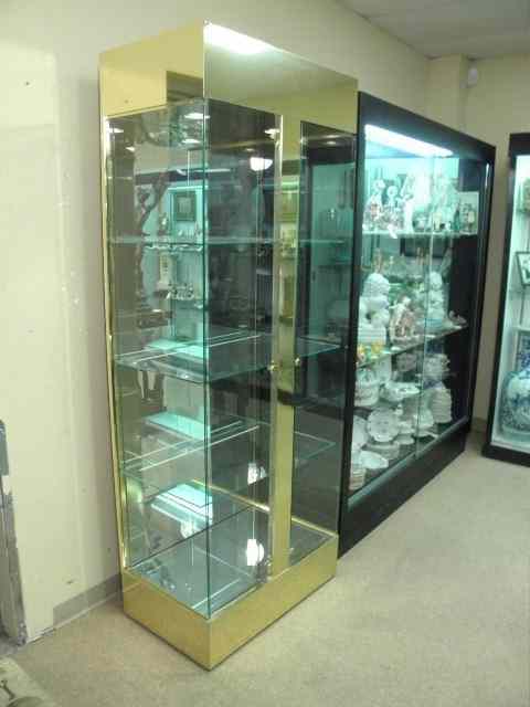 Appraisal: Brass and glass double door display case Lit with two