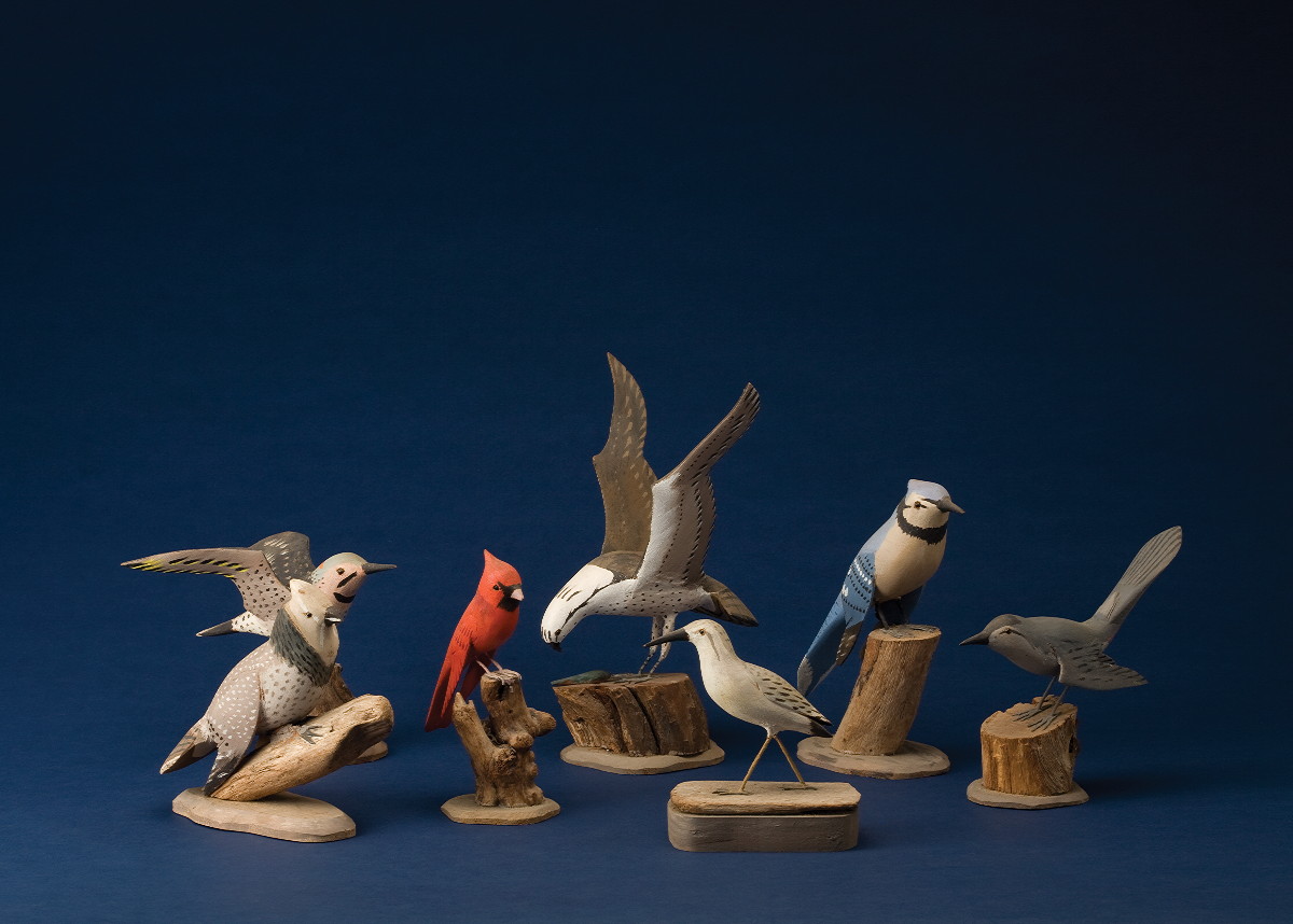 Appraisal: TWENTY-FOUR CARVED AND PAINTED BIRDS CIRCA Each by the same