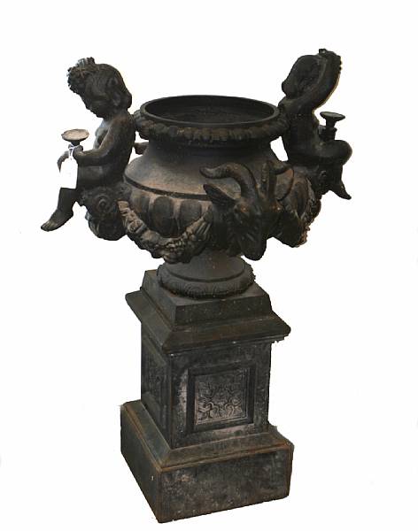 Appraisal: A pair of cast iron jardinieres on pedestals overall height