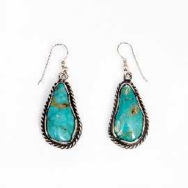 Appraisal: A pair of sterling silver turquoise set pendant earrings length