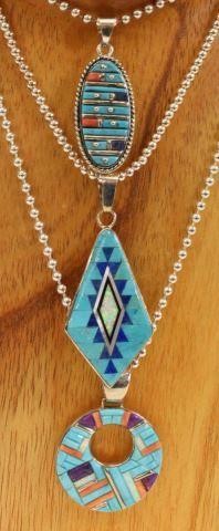 Appraisal: lot of Southwest style sterling silver pendant necklaces with multi-stone