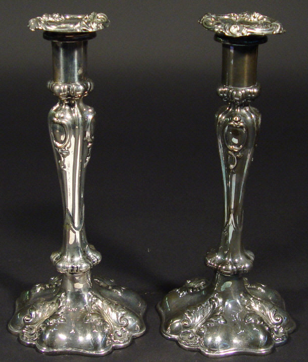 Appraisal: Pair of ornately cast silver plated candlesticks with acanthus mouldings