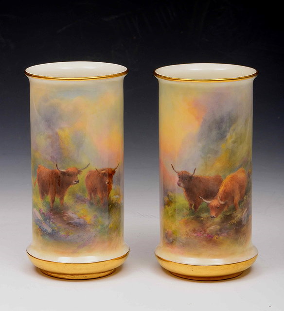 Appraisal: A pair of Royal Worcester vasespainted with Highland cattle by