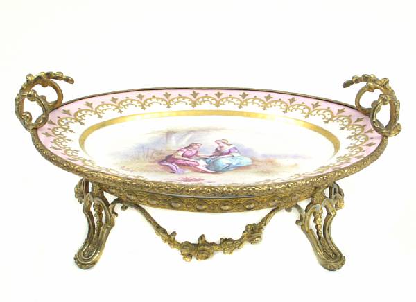 Appraisal: A Sevres style porcelain gilt bronze mounted centerpiece height in