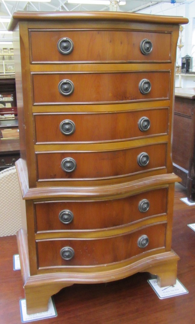 Appraisal: A th century yew serpentine chest on chest of six