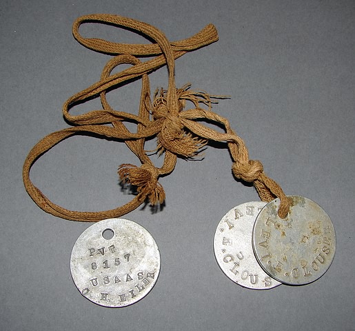 Appraisal: Pair dog tags with original string and other dog tag