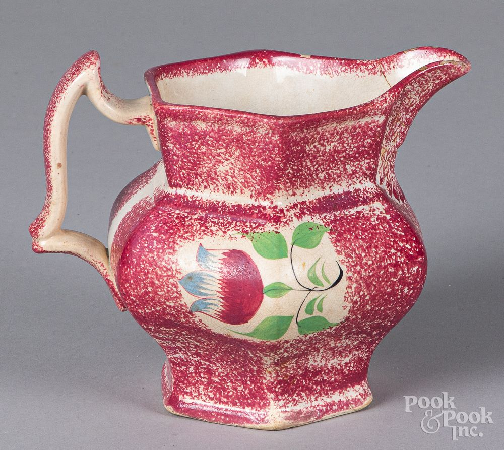 Appraisal: Red spatter pitcher with tulip Red spatter pitcher with tulip