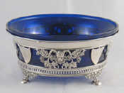 Appraisal: A German assay silver bowl with blue liner on paw