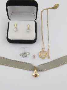 Appraisal: Three ct gold pendants one locket one ring and a