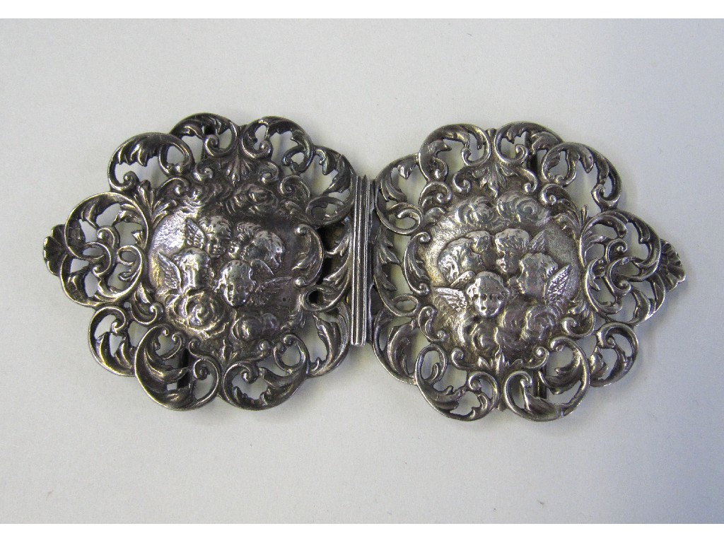 Appraisal: Silver belt buckle embossed with winged putti Birmingham