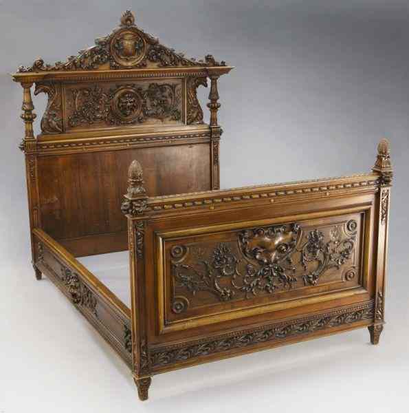 Appraisal: Carved walnut Renaissance Revival bedwith an elaborately carved headboard featuring