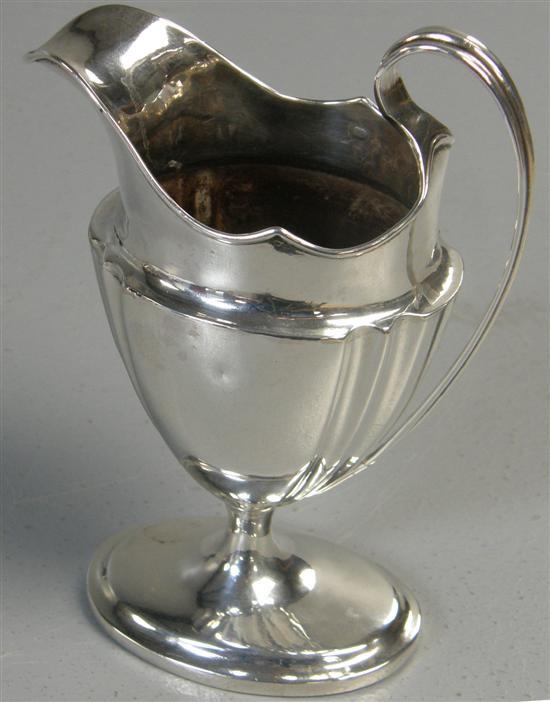 Appraisal: George III Irish silver cream jug with plain long curved