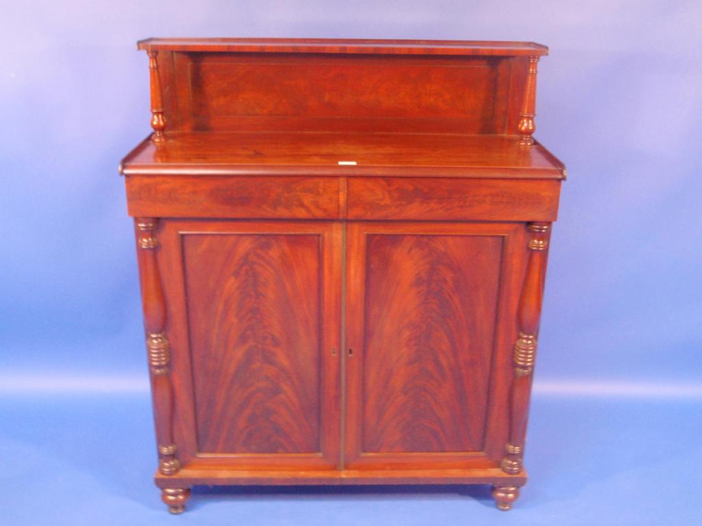 Appraisal: A Victorian flamed mahogany chiffonier with panel back and shelves