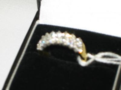 Appraisal: A DIAMOND RING with sixteen matched stones in two rows