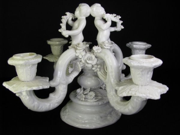 Appraisal: Italian porcelain blanc de chine faience four arm candelabra with