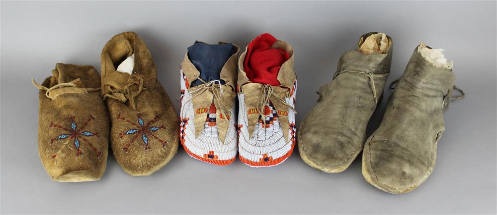 Appraisal: THREE PAIRS OF NATIVE AMERICAN HIDE MOCCASINS ONE PAIR OF