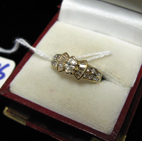 Appraisal: DIAMOND AND FOURTEEN KARAT GOLD RING centering a single marquise-cut