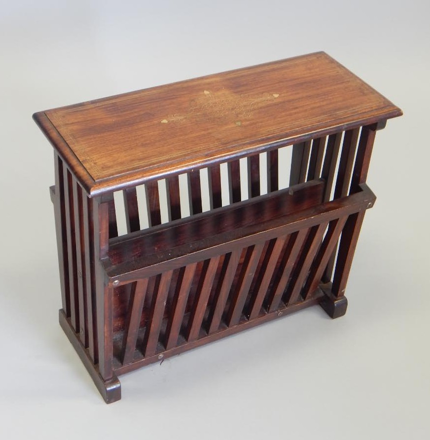 Appraisal: An Eastern hardwood magazine rack with brass inlay to the