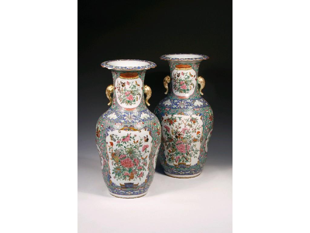 Appraisal: A PAIR OF CANTONESE FAMILLE ROSE VERTE VASES enamelled in