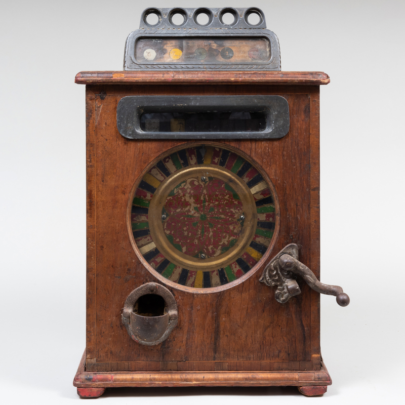 Appraisal: Edwardian Oak and Metal Gambling Machine With Painted Face and