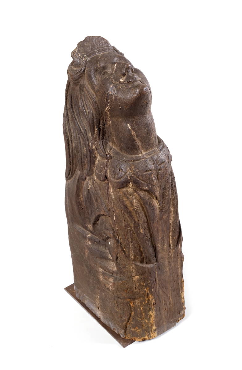 Appraisal: BUST-LENGTH CARVED BILLETHEAD OF A WOMAN WITH FLOWING HAIR WEARING