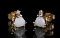 Appraisal: An Elegant Pair of Opal Diamond Ear Studs k yellow