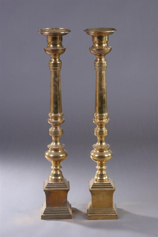 Appraisal: PAIR RENAISSANCE-STYLE BRASS ALTAR PRICKET CANDLESTICKS th century The stepped