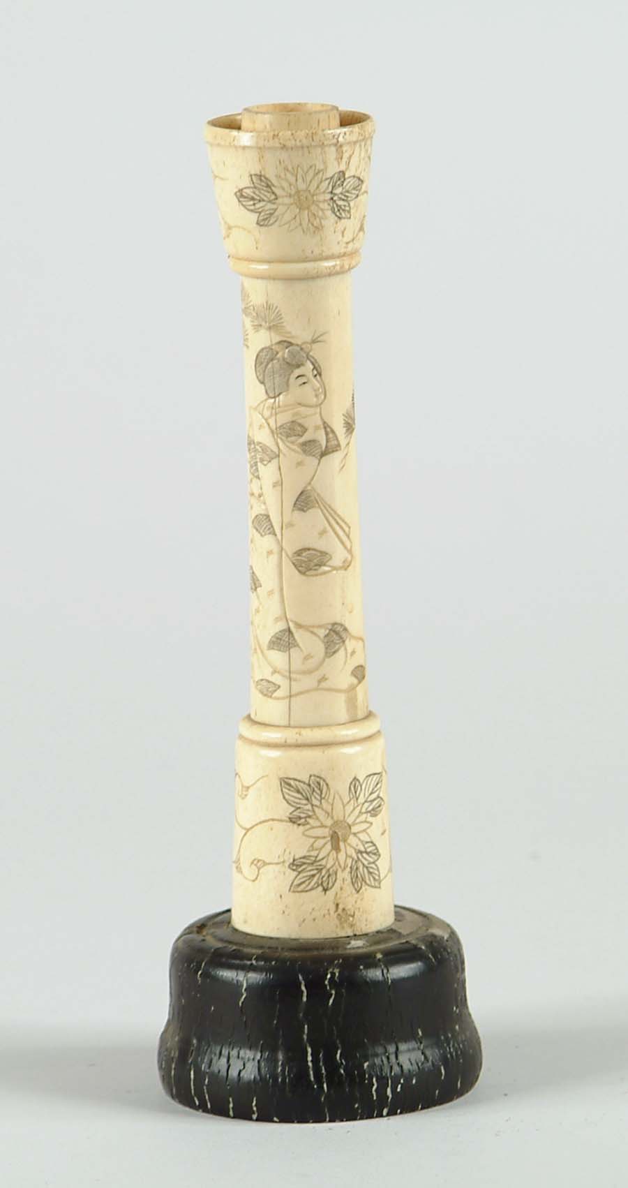 Appraisal: SCRIMSHAW DECORATED IVORY CANDLESTICK Ivory shaft is decorated with Geisha