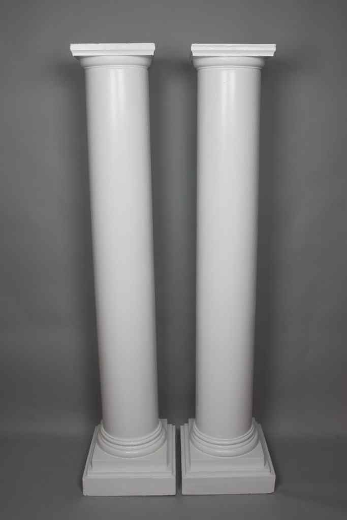 Appraisal: PAIR OF WHITE PAINTED WOODEN COLUMNS flat top above a