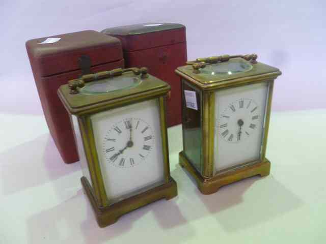 Appraisal: TWO SIMPLE BRASS CARRIAGE CLOCKS with enamel dial and loop