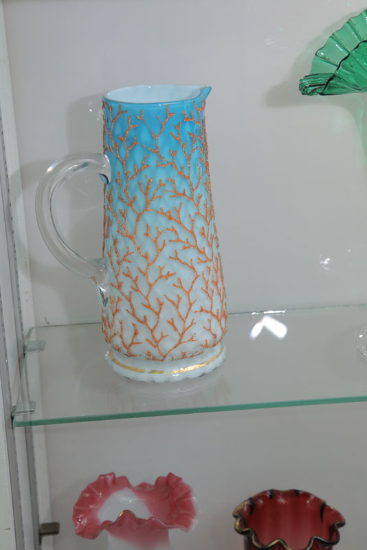 Appraisal: ART GLASS PITCHER Having Coralene decoration over a criss cross