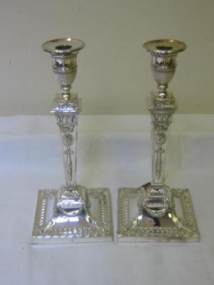 Appraisal: A PAIR OF CANDLESTICKS with circular drip trays half fluted