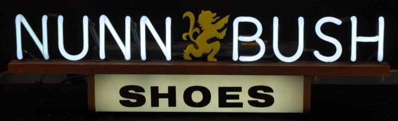 Appraisal: Nunn Bush Can Neon Sign Description s White neon on