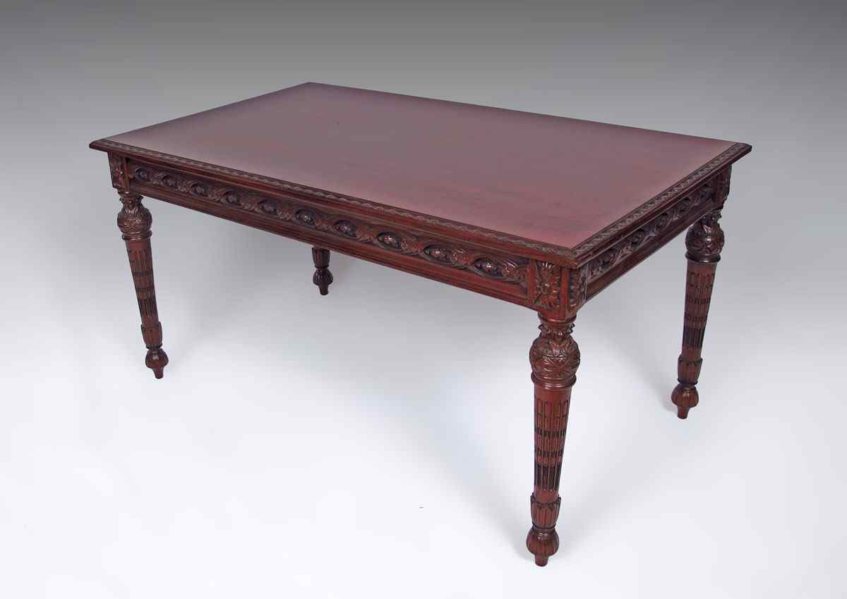 Appraisal: CARVED MAHOGANY COFFEE TABLE Carved rim apron and legs ''h