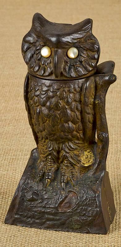 Appraisal: Cast iron owl turning head mechanical bank manuf Cast iron