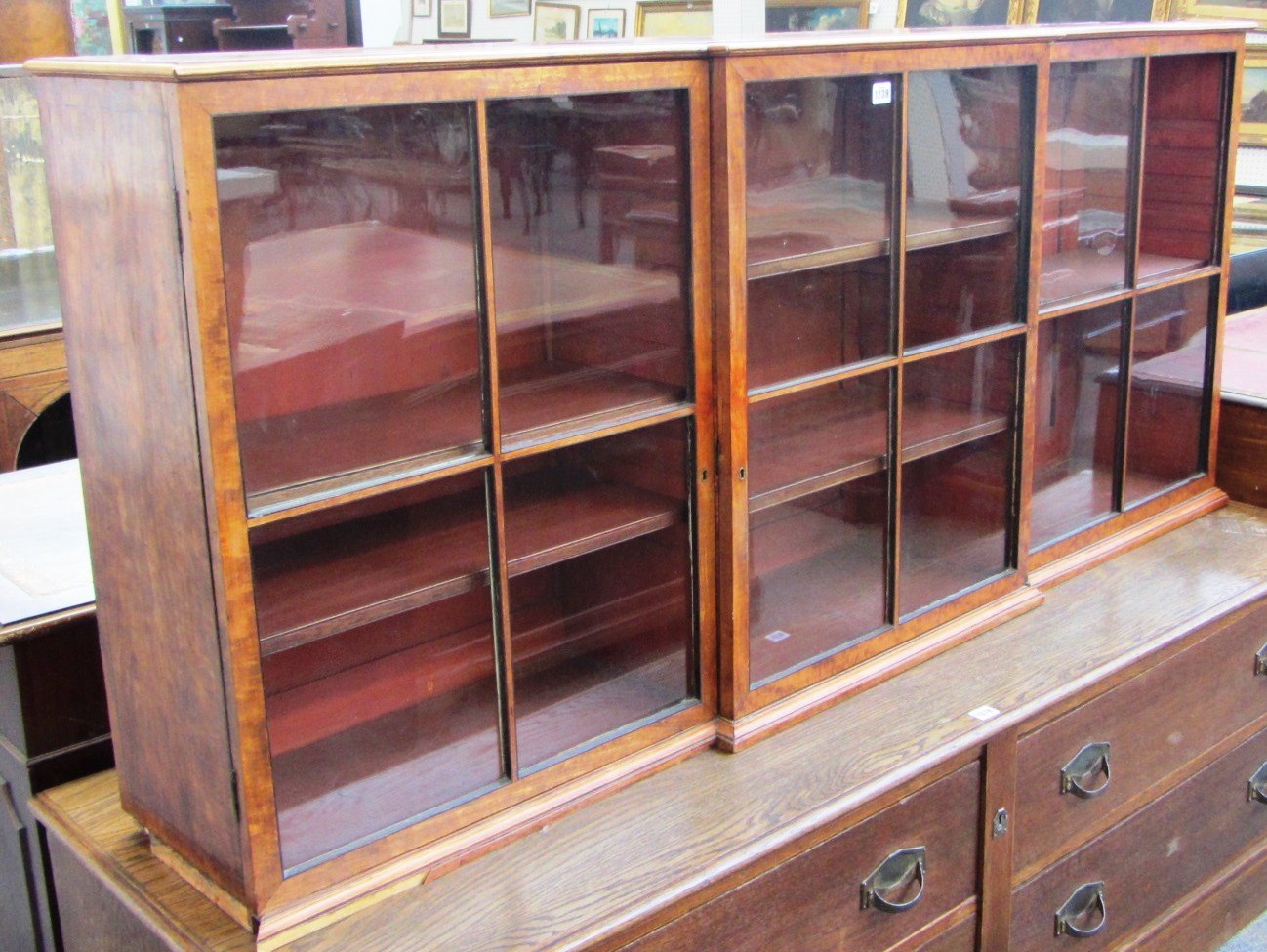 Appraisal: A George III satinwood floor standing breakfront three door bookcase