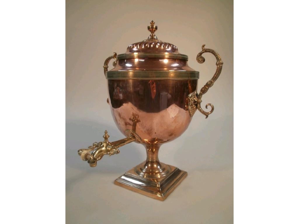 Appraisal: A Regency copper and brass samovar with two leaf capped